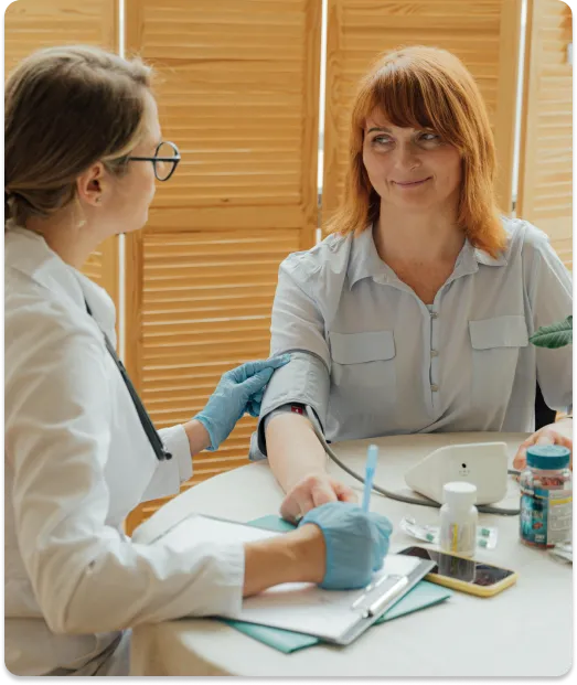 Female patient having blood pressure checked in Eastern Medicine consultation room